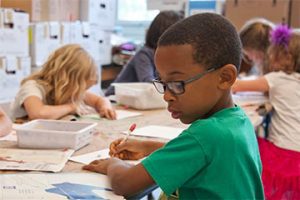 Photo of a young boy in a school setting.