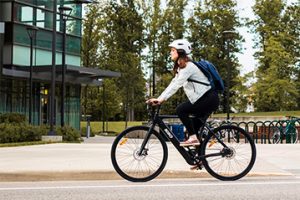 Image of a woman riding a bike.