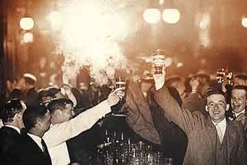 Photo of celebrators in the 1930s in a bar