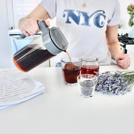 Female pouring coffee into a glass. Source: TakeyaUSA.com.