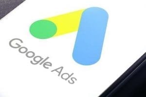 Image of an mobile phone with Google Ads logo on the screen