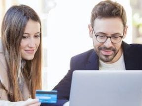 Photo of a female and buy shopping on a laptop