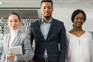 Image of three office workers: 2 females and 1 male