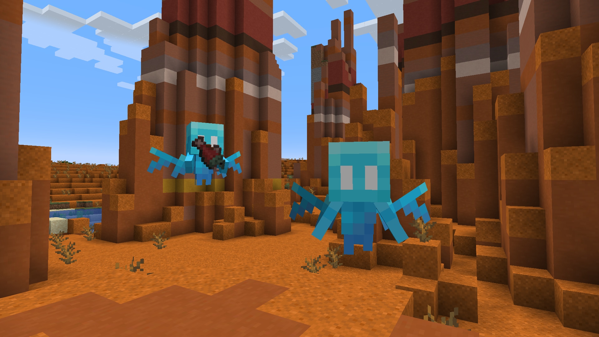 Two allay mobs flying in a badlands biome