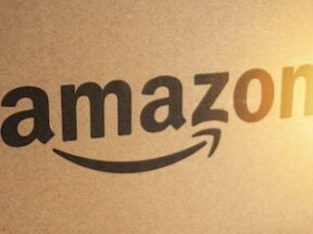 Amazon Prime box or Amazon shipping box on black background. Crop fragment, business concept