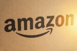 Amazon Prime box or Amazon shipping box on black background. Crop fragment, business concept