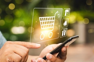 Person holding a smartphone with a shopping cart icon superimposed