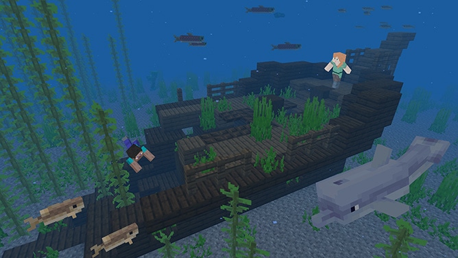 Steve and Alex underwater exploring a shipwreck