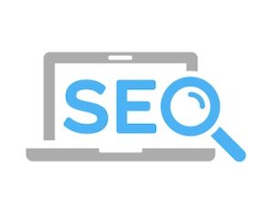 Illustration of the text "SEO" in front of a laptop screen