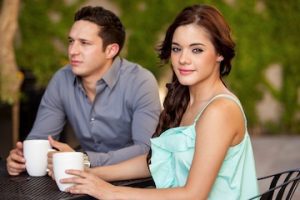 Photo of female and male drinking coffee on a date