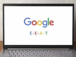 Laptop screen with Google logo and the letters "E - E- A - T"