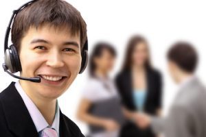 Photo of a male customer service rep wearing a headset