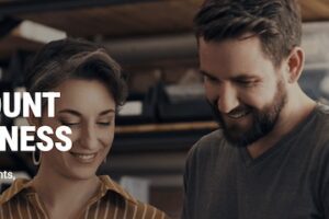 Photo from WorldFirst of a male and female looking at a computer tablet