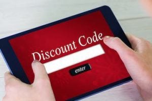 Photo of a tablet with a discount code box on the screen