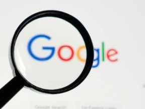 Magnifying glass on top of the Google logo