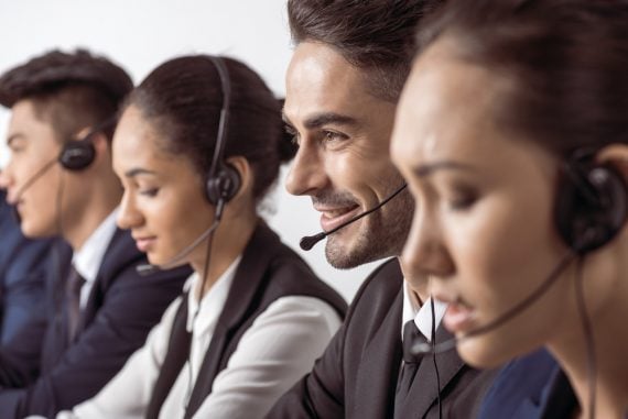 Photo of support staff speaking on headsets