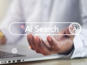 Image of a person working on a laptop with the words "AI Search" superimposed