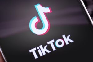 TikTok logo on a smartphone screen